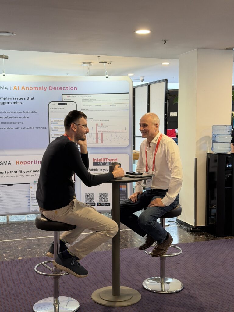 Rozhovor u stánku initMAX – Zabbix Summit 2026, Riga