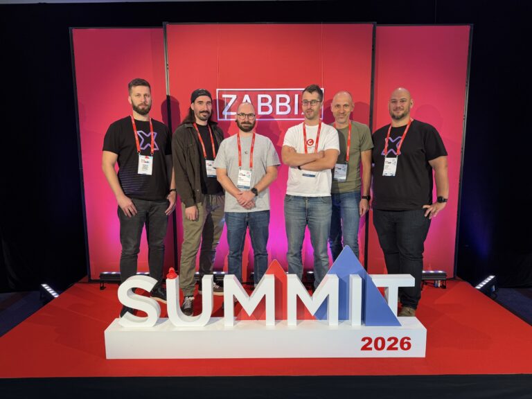 Tým u fotostěny Zabbix Summit 2026 – Zabbix Summit 2026, Riga